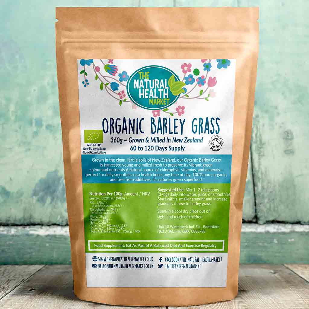 Bag of Organic Barley Grass from The Natural Health Market on a wooden surface with a green background