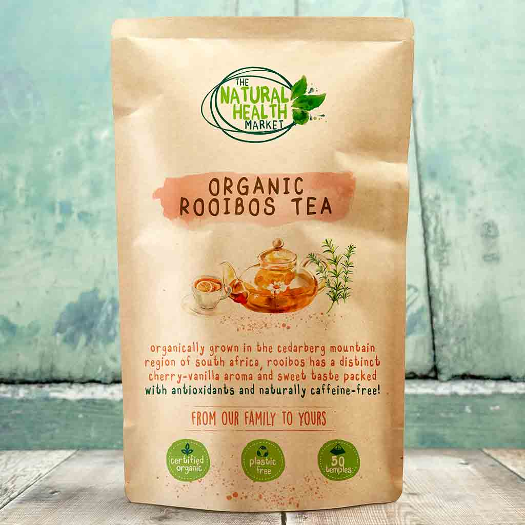 Bag of Organic Rooibos Tea from The Natural Health Market on a wooden surface with a blue-green gradient background.