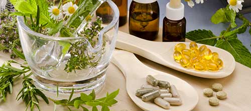 Nootropic supplements and green herbs on display.