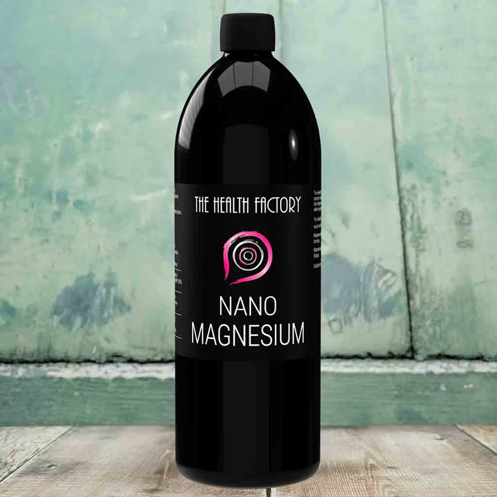 Black 1 litre bottle of 'Nano Magnesium' by 'The Health Factory' on a wooden surface with a greenish background.