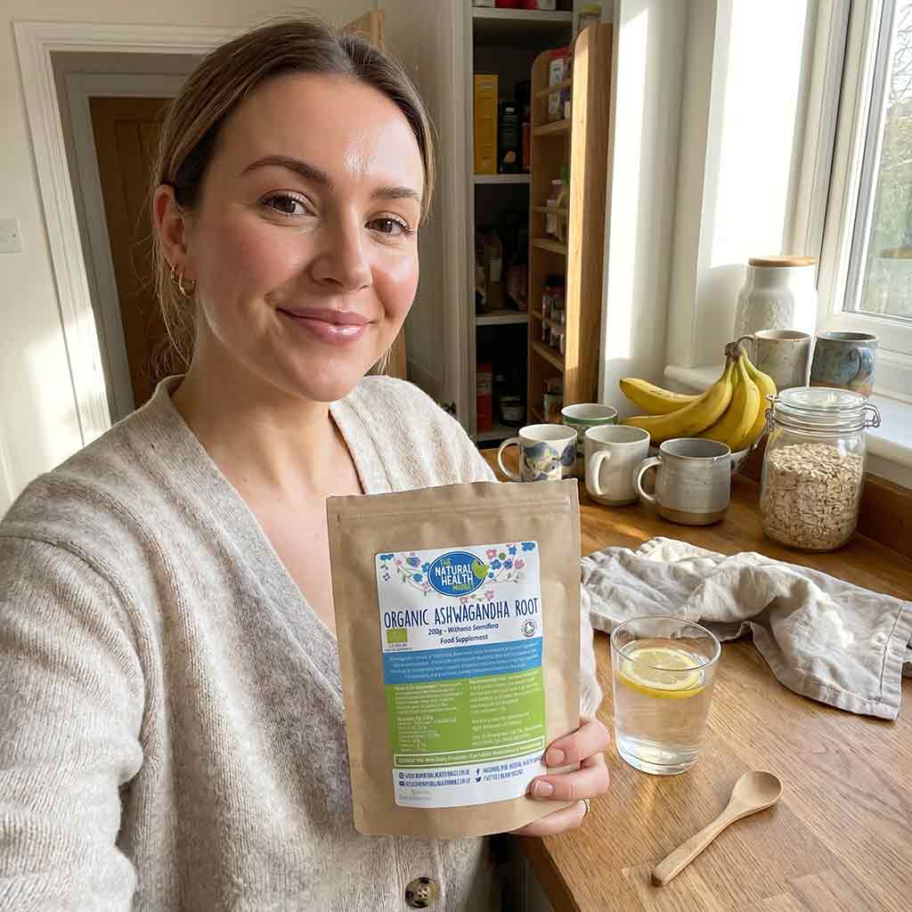 Woman holding a package of Organic Ashwagandha Root in a kitchen setting.