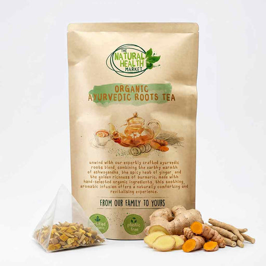 Package of Organic Ayurvedic Roots Tea from The Natural Health Market with tea leaves and roots on a white background.