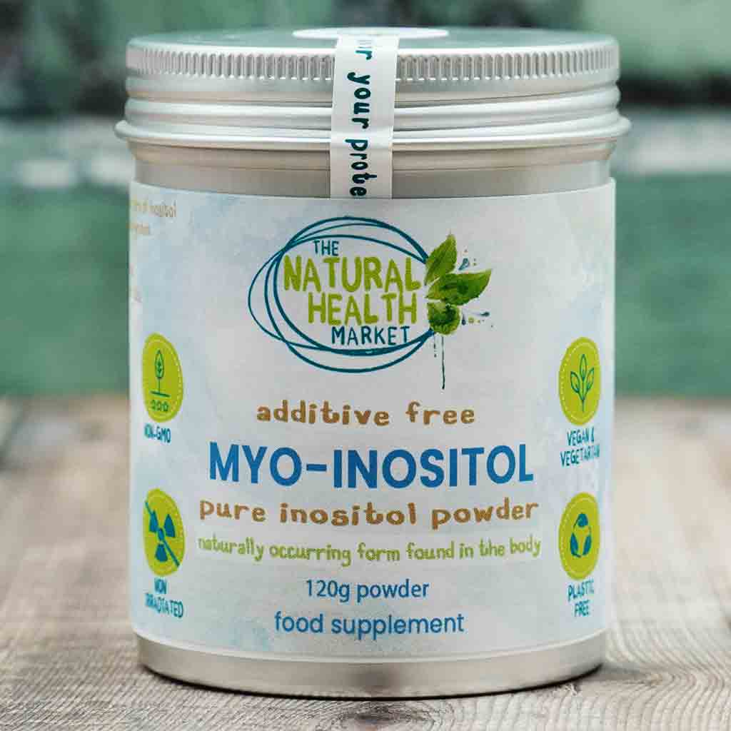 Container of MYO-INOSITOL powder from The Natural Health Market on a wooden surface.