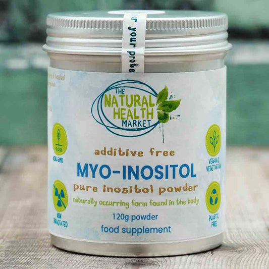 Container of MYO-INOSITOL powder from The Natural Health Market on a wooden surface.