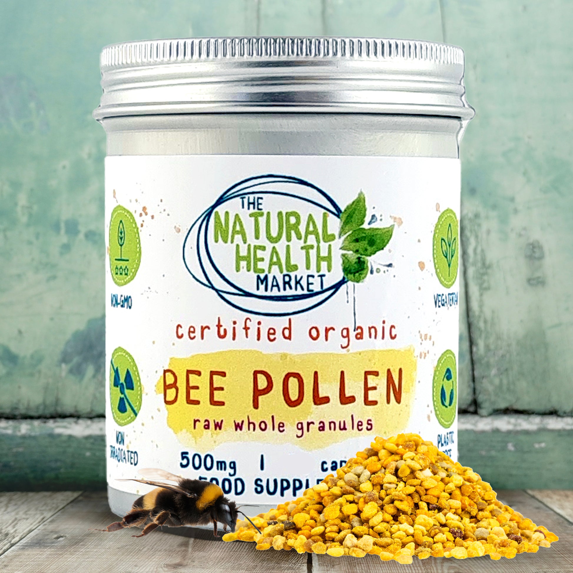 Tin of bee pollen capsules with 'The Natural Health Market' label on a wooden surface.