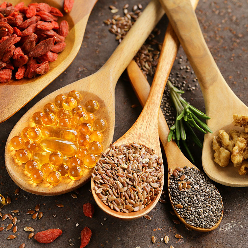 A selection of hand made organic supplements including hibiscus flower capsules, maca capsules, spirulina capsules and turmeric capsules 