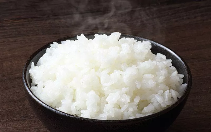 A bowl of white fluffy jasmine rice.