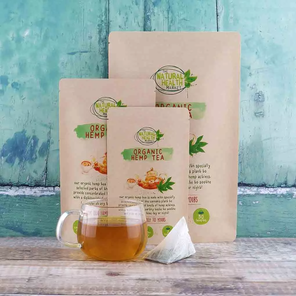 Organic Hemp Tea Bags by The Natural Health Market - All sizes with a freshly brewed cup of hemp tea in a glass cup.